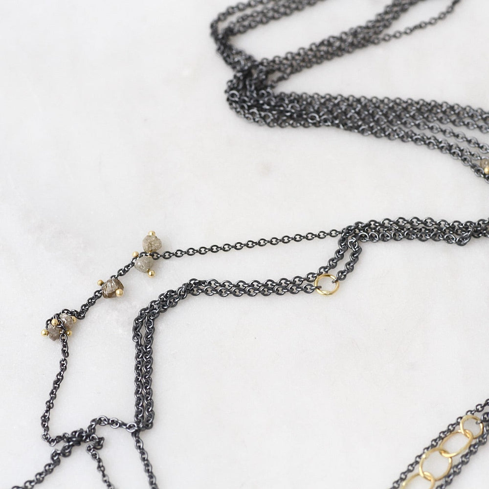 
                  
                    NKL-18K Cat's Cradle Necklace with Raw Diamonds
                  
                