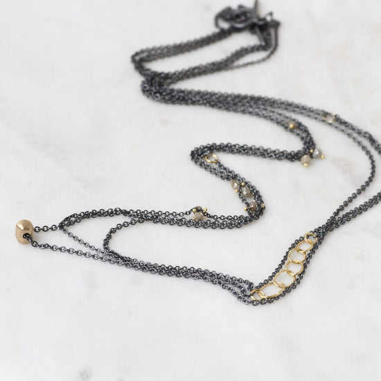 NKL-18K Cat's Cradle Necklace with Raw Diamonds