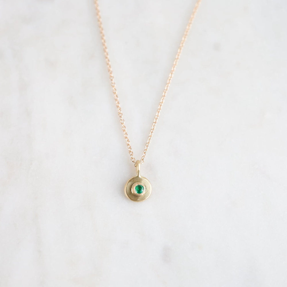 
                  
                    NKL-18K Emerald Dot Necklace
                  
                