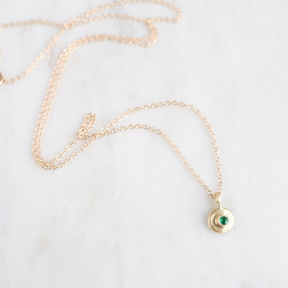 
                  
                    NKL-18K Emerald Dot Necklace
                  
                