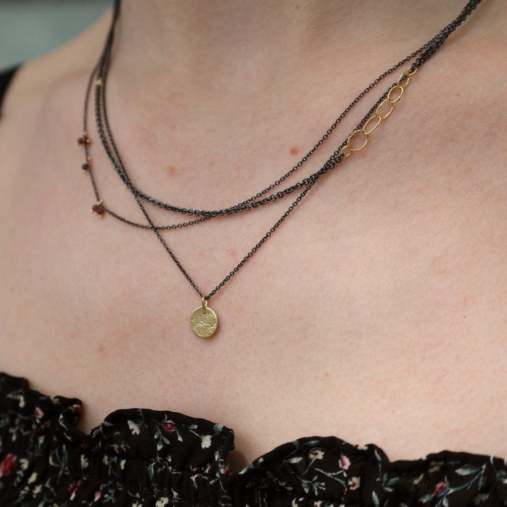 NKL-18K Parchment Disk Triple Chain Necklace with Garnets