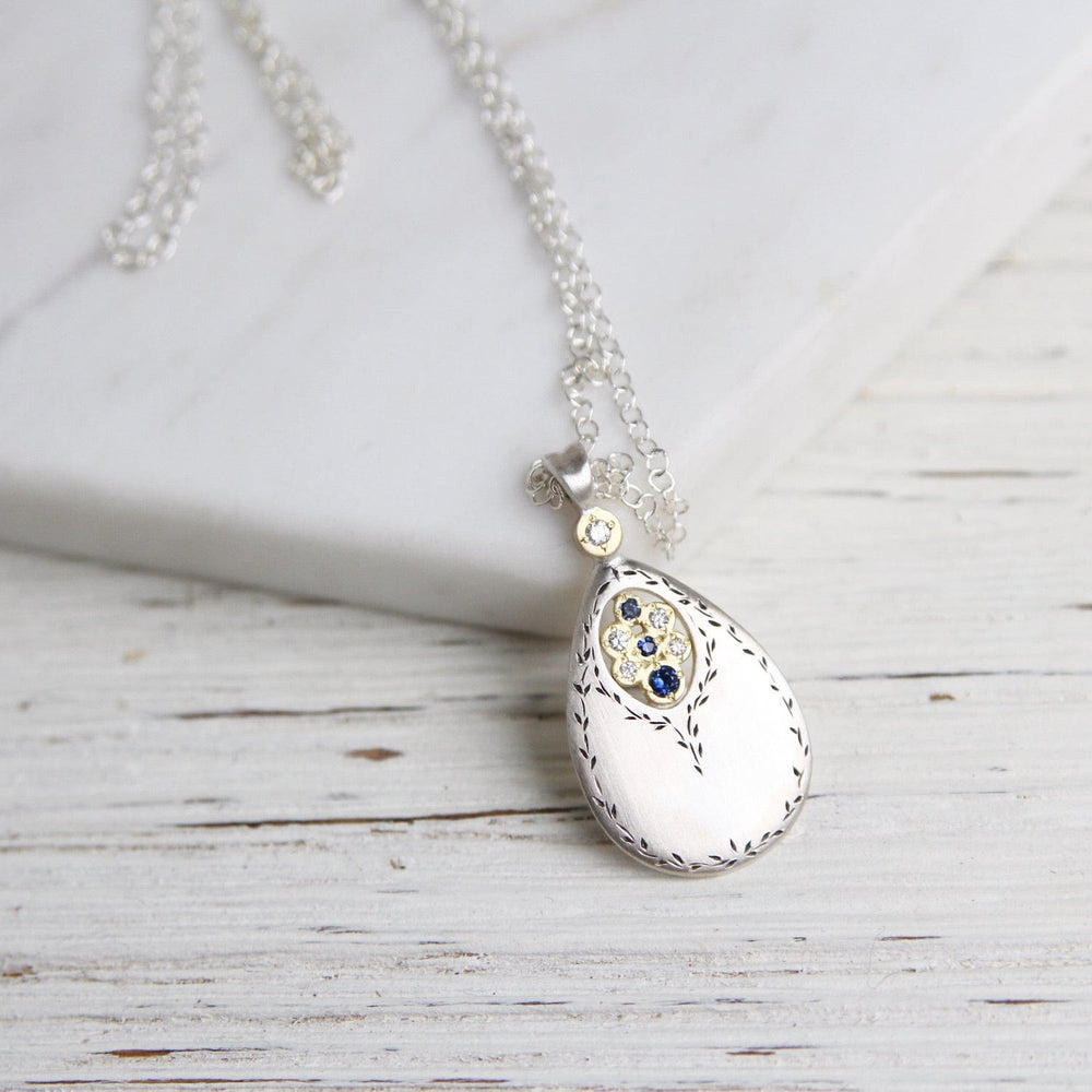 
                      
                        NKL-18K Secret Garden Drop Pendant in Sapphire & Diamond
                      
                    