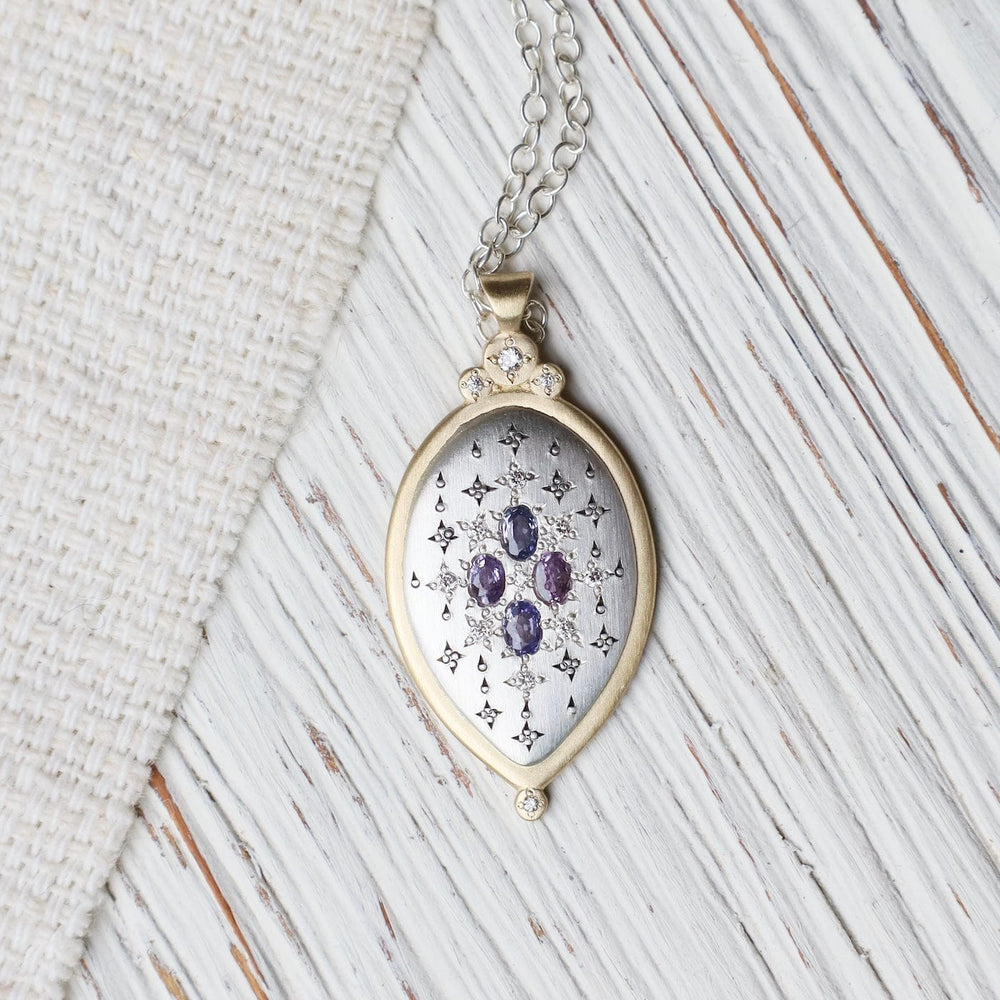 
                  
                    NKL-18K Two Tone Oval Sapphire Pendant Necklace
                  
                