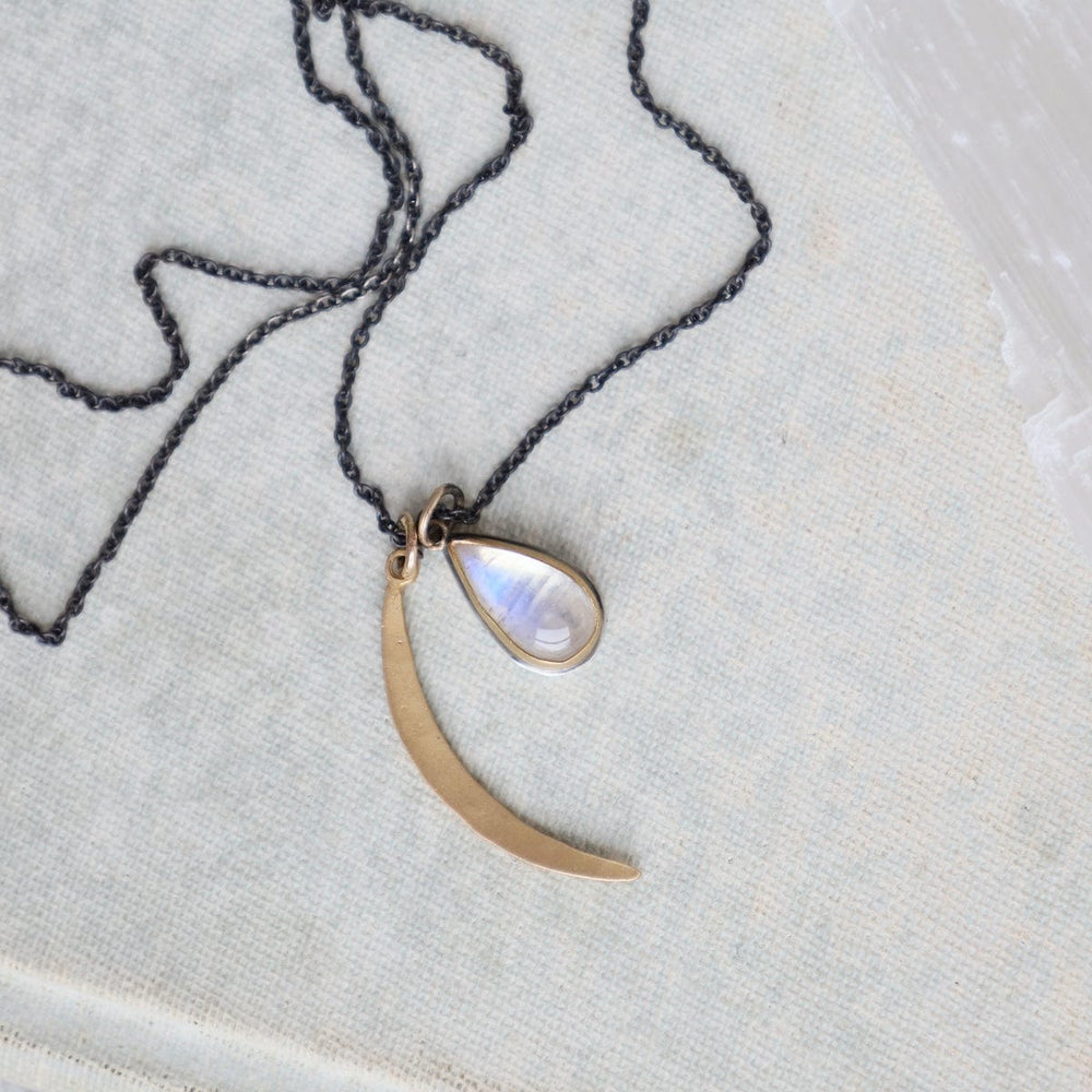 
                      
                        NKL-22K 22k Bezel Set Smooth Moonstone & 22k Crescent Moon
                      
                    