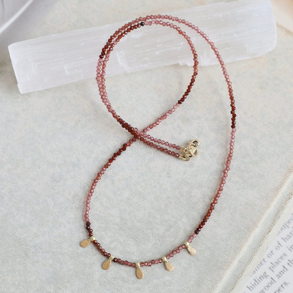 
                      
                        NKL-22K Beaded Ombre Rhonolite Garnet Necklace with 5 22k
                      
                    