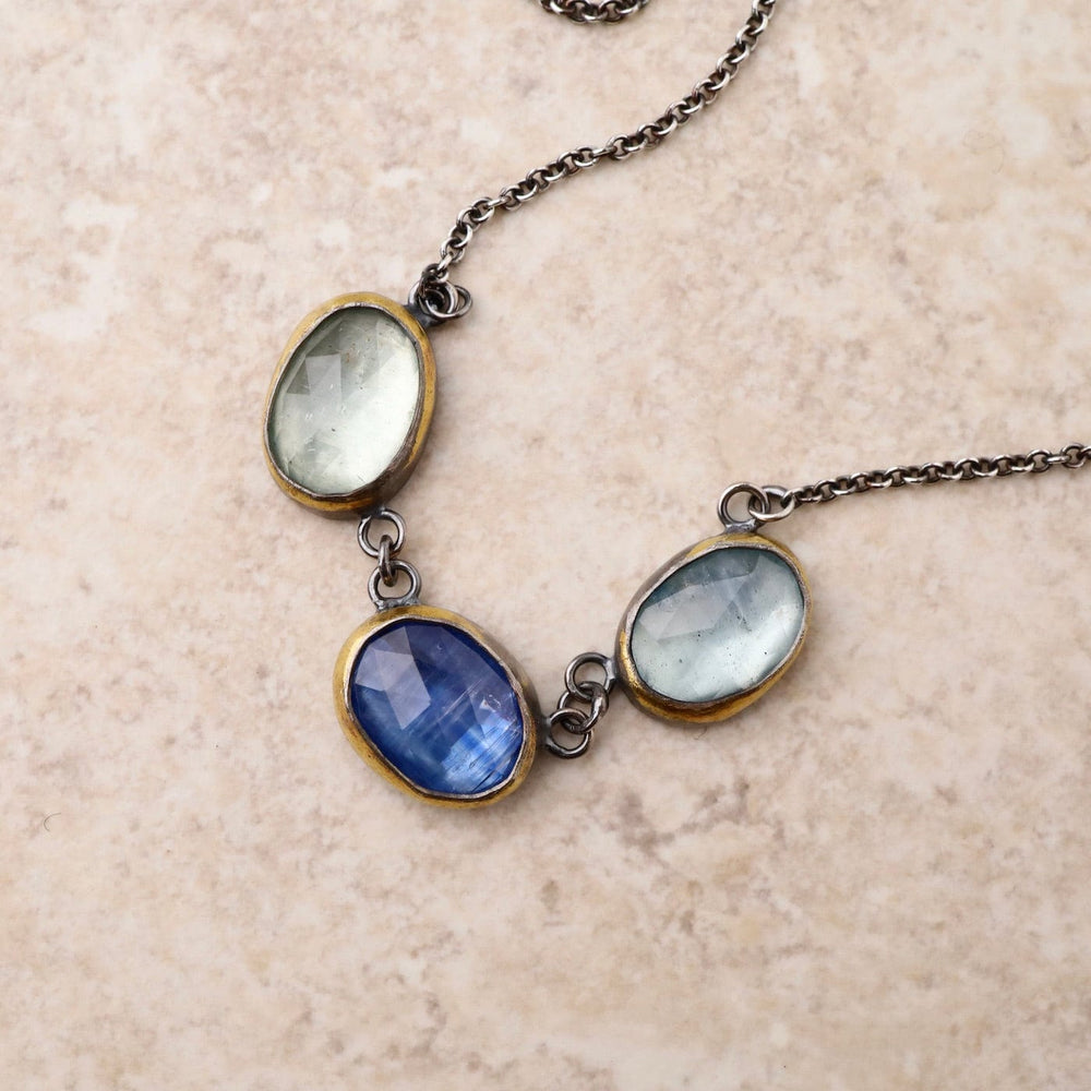 
                      
                        NKL 3 Crescent Rim Necklace with Kyanite & Aquamarine
                      
                    