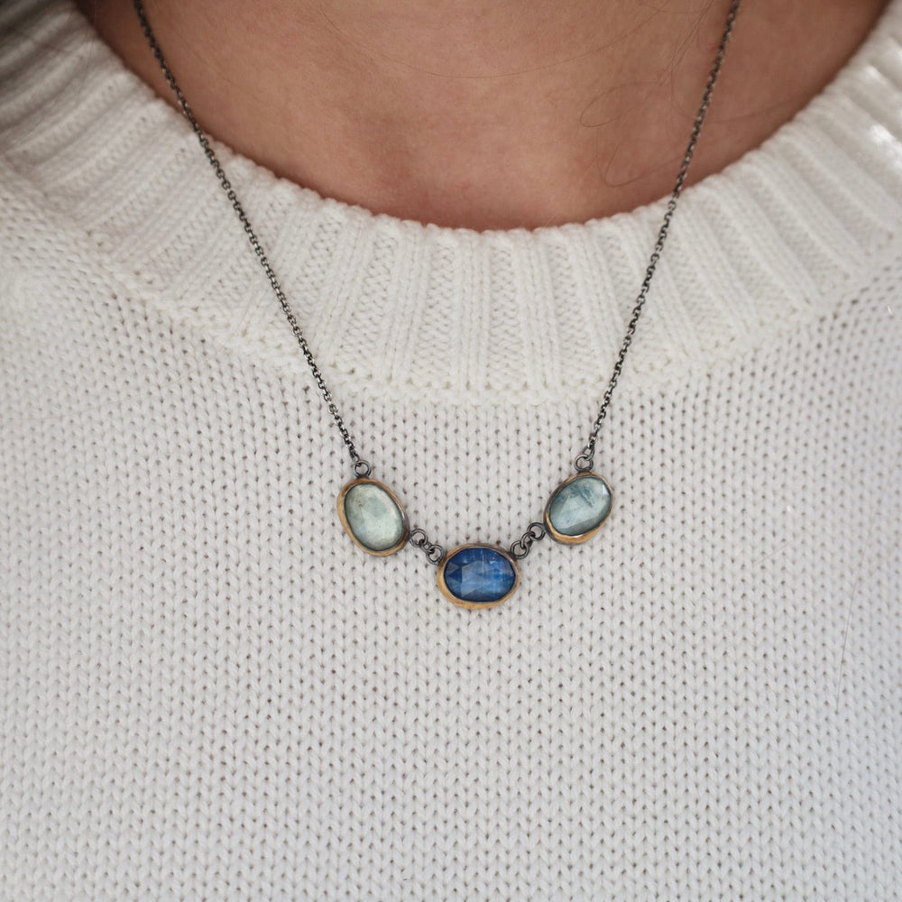 
                      
                        NKL 3 Crescent Rim Necklace with Kyanite & Aquamarine
                      
                    