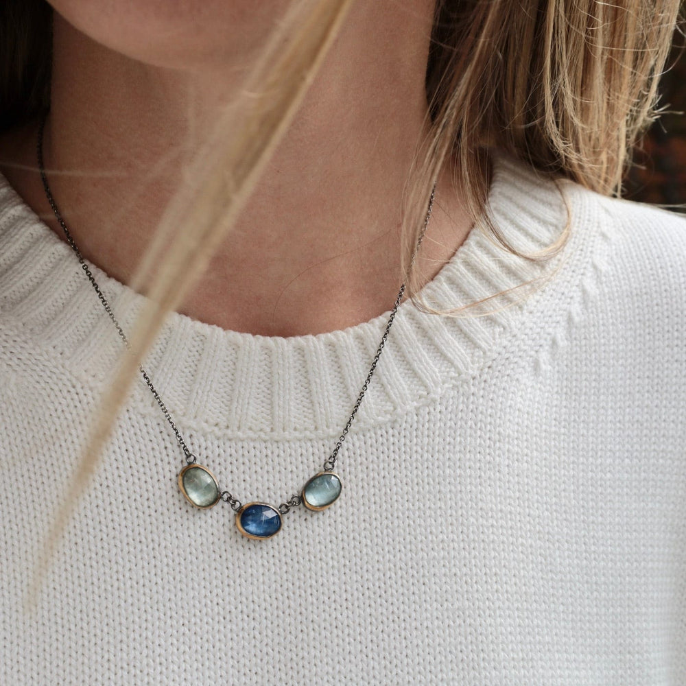 
                      
                        NKL 3 Crescent Rim Necklace with Kyanite & Aquamarine
                      
                    