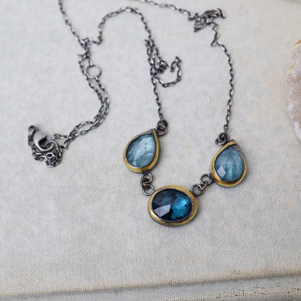 
                  
                    NKL 3 Crescent Rim Necklace with Teal Kyanite & Aquama
                  
                