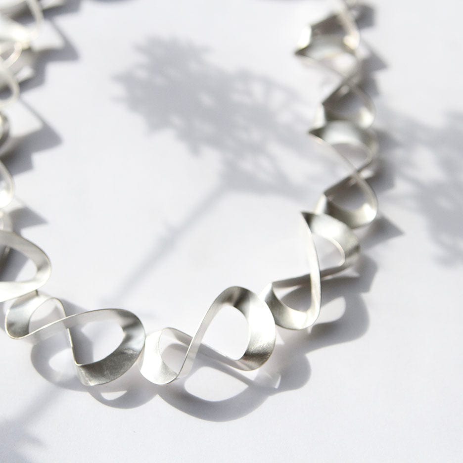 
                      
                        NKL 3D Ribbon Necklace
                      
                    