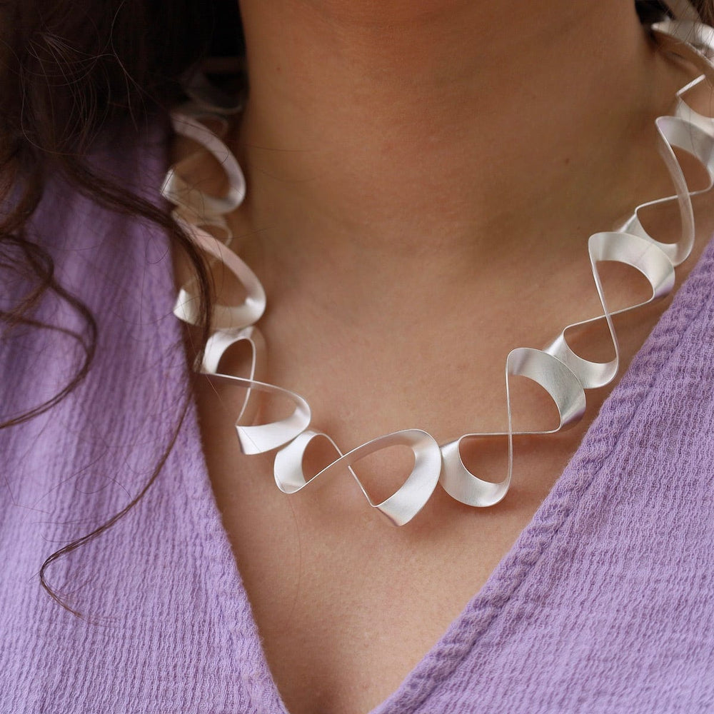 
                      
                        NKL 3D Ribbon Necklace
                      
                    