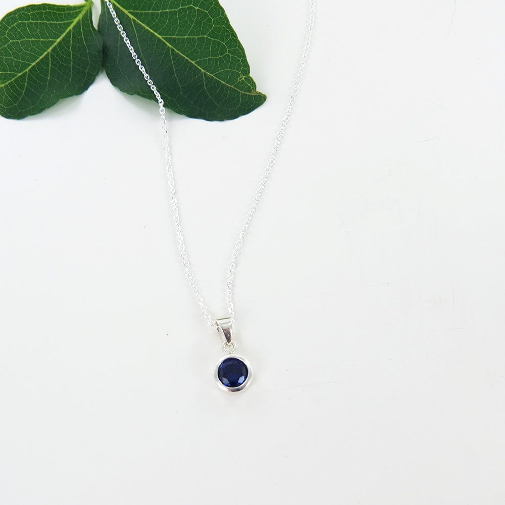 
                      
                        NKL 6.5mm Synthetic Sapphire Bezel Set Pendant
                      
                    