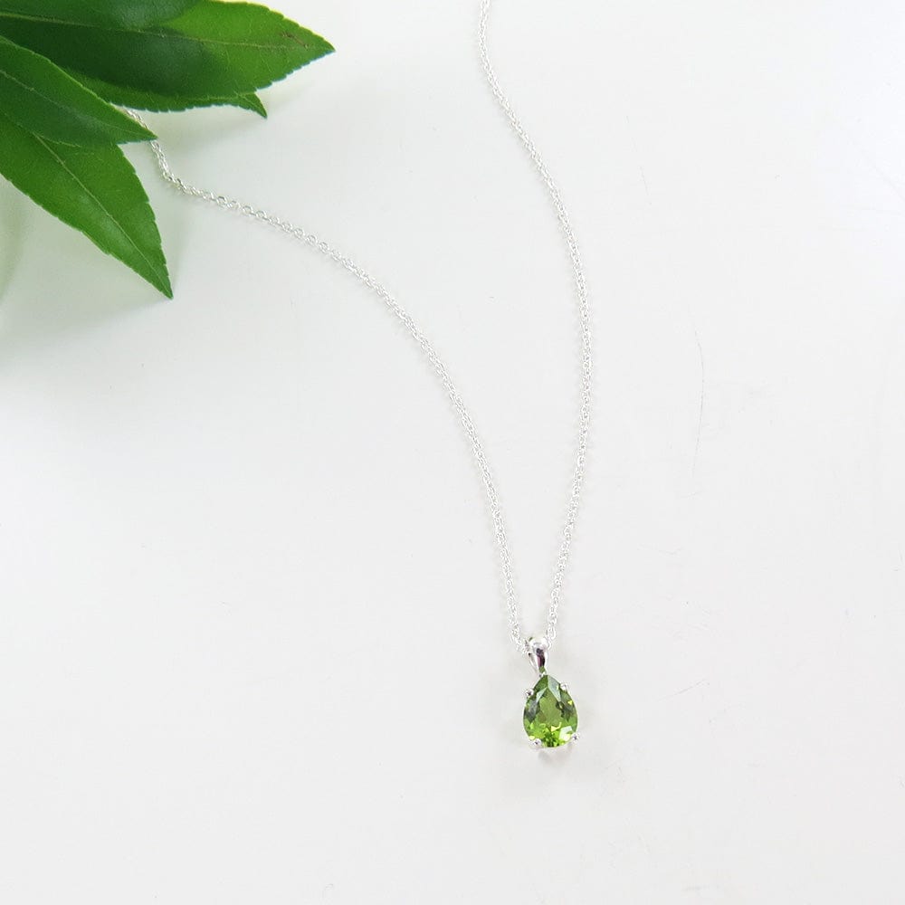 NKL 8x5MM PRONG SET PEAR SHAPED PERIDOT PENDANT