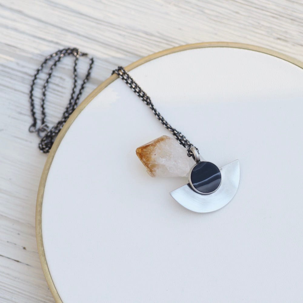 
                      
                        NKL Banded Black Onyx Half Moon Pendant
                      
                    