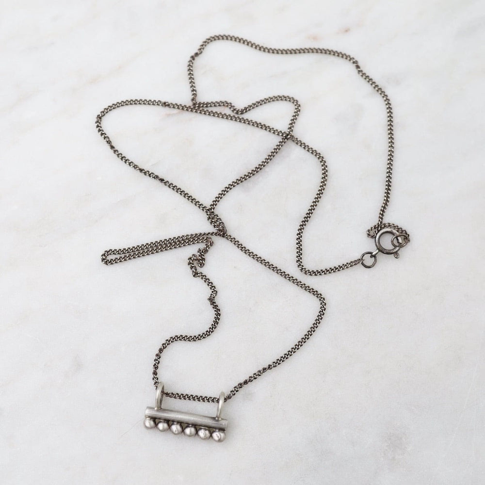 
                      
                        NKL Bar Amulet Necklace
                      
                    