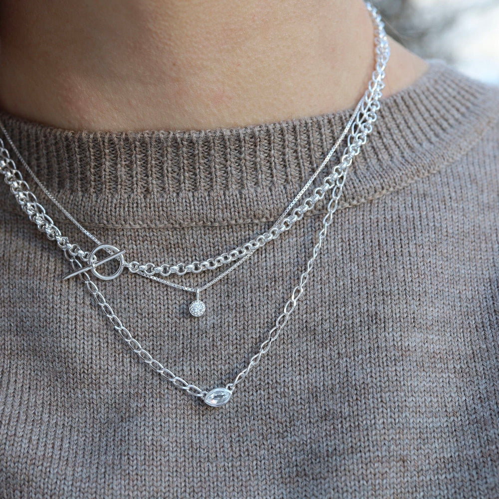 
                      
                        NKL Bezel Set Marquise White Topaz on Sterling Silver Cut Curb Chain
                      
                    