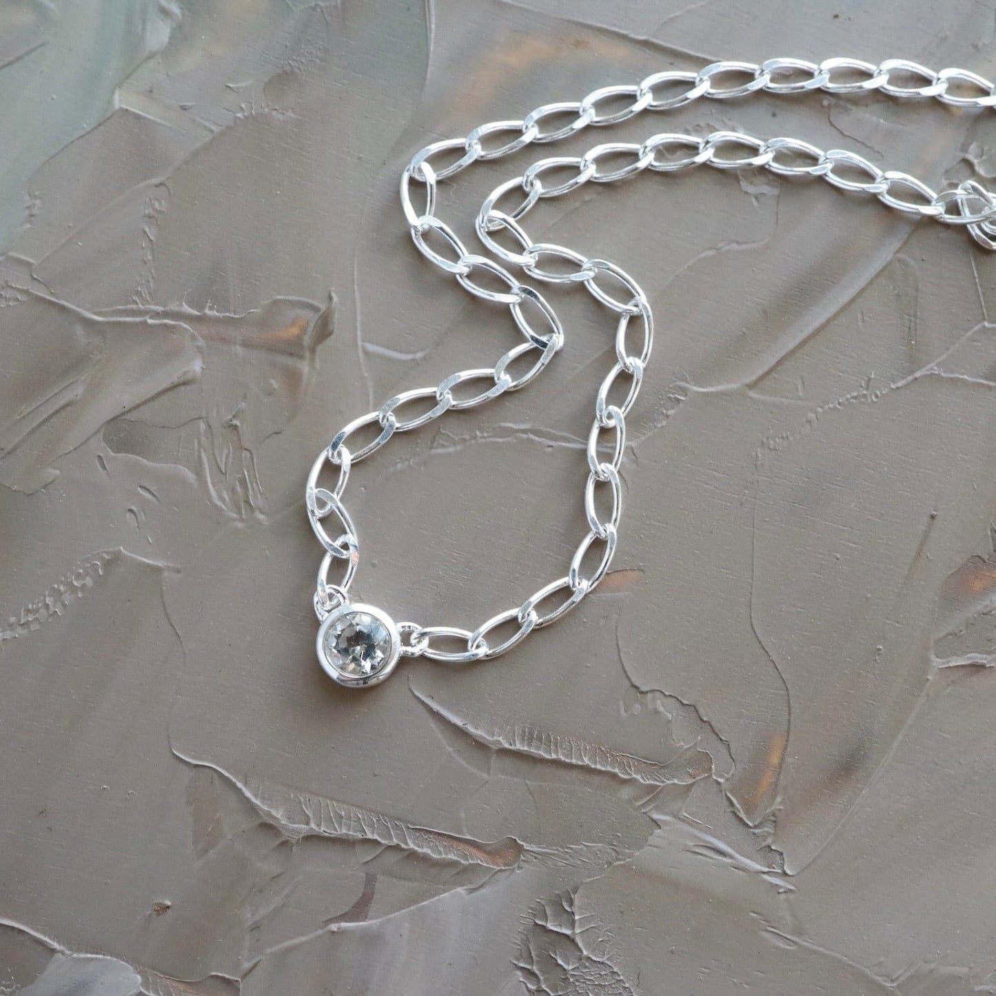 NKL Bezel Set Round White Topaz on Sterling Silver Cut Curb Chain