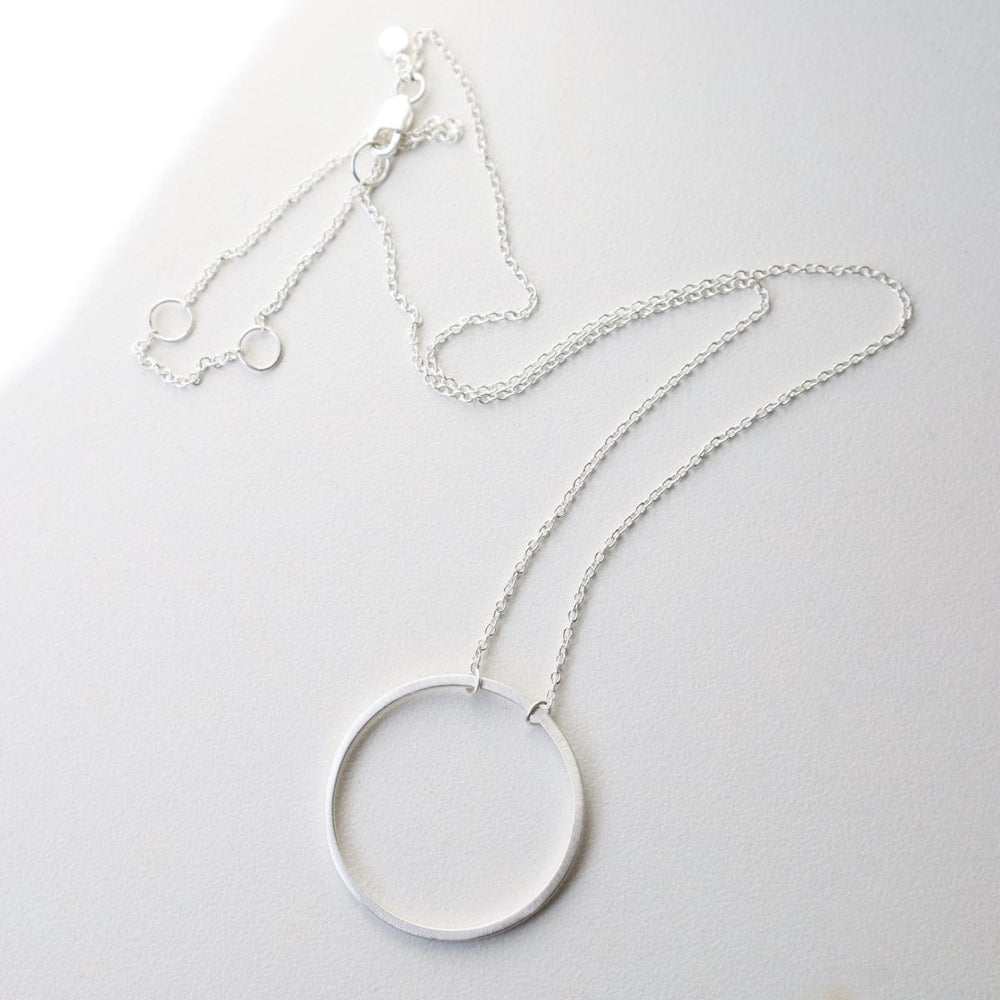 
                      
                        NKL Big Wire Circle Necklace in Brushed Sterling Silver
                      
                    