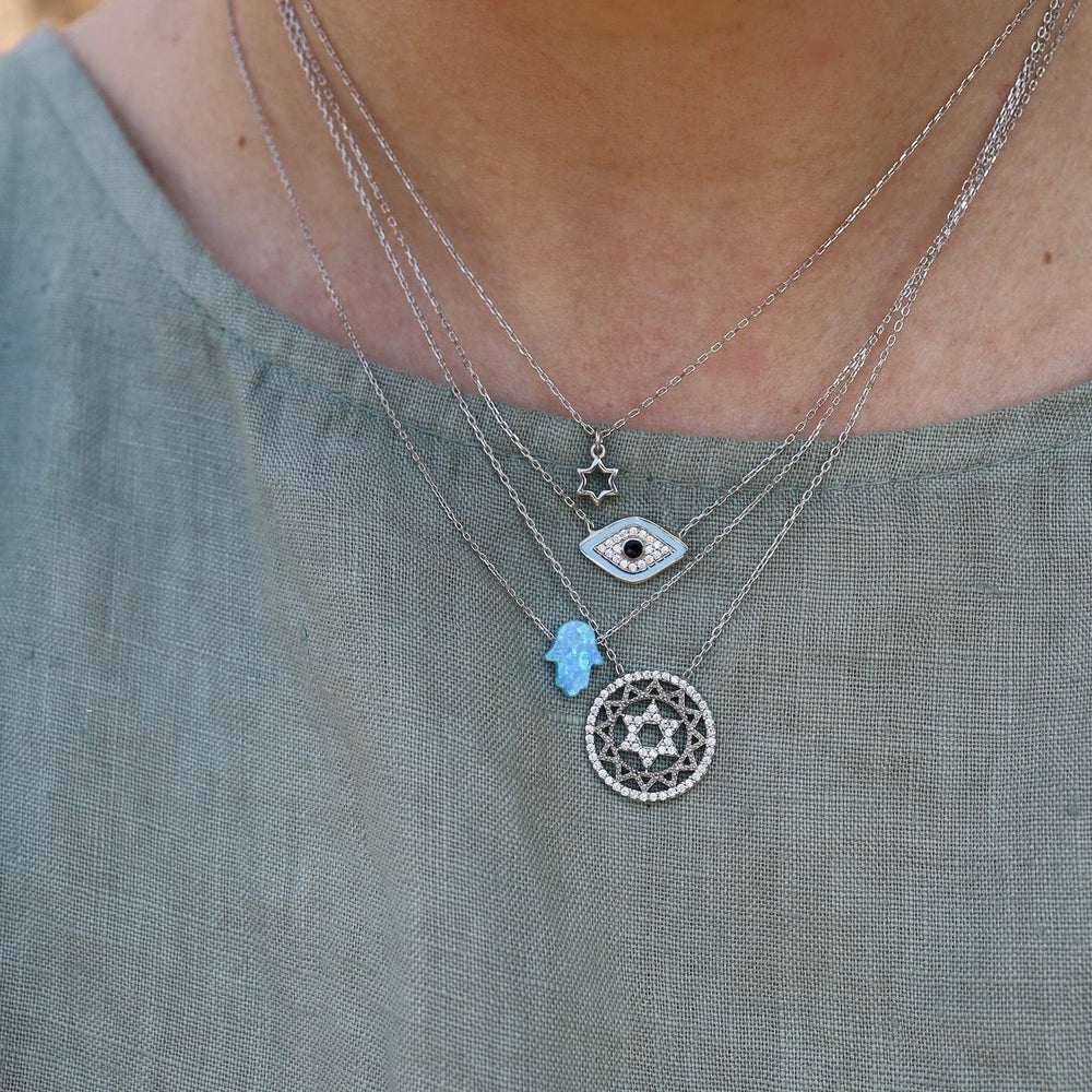 
                  
                    NKL Blue Opal Hamsa Hand Necklace on Sterling Silver Chain
                  
                