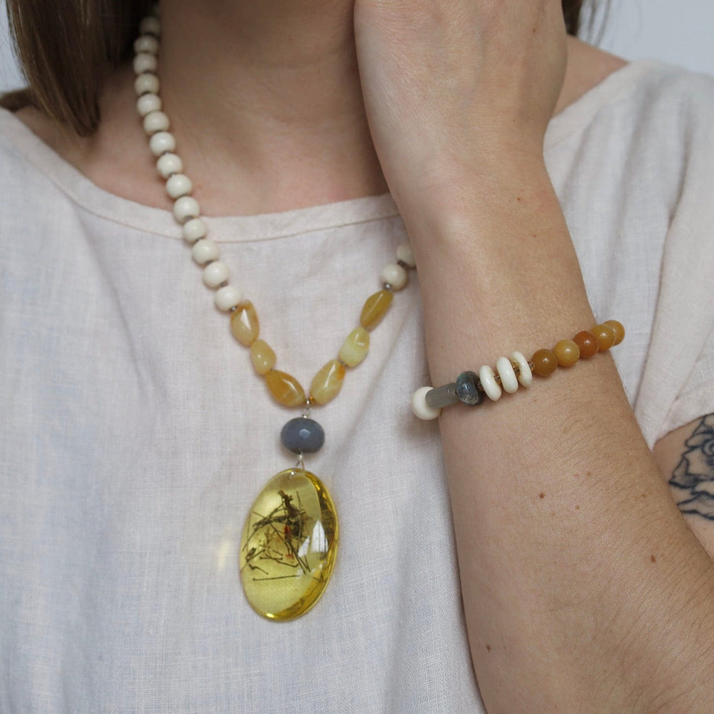 
                  
                    NKL Bone & Yellow Jade Necklace with Amber Pendant Necklace
                  
                