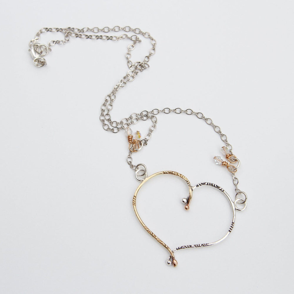 
                  
                    NKL Brass & Sterling Silver Ribbon Heart Necklace
                  
                