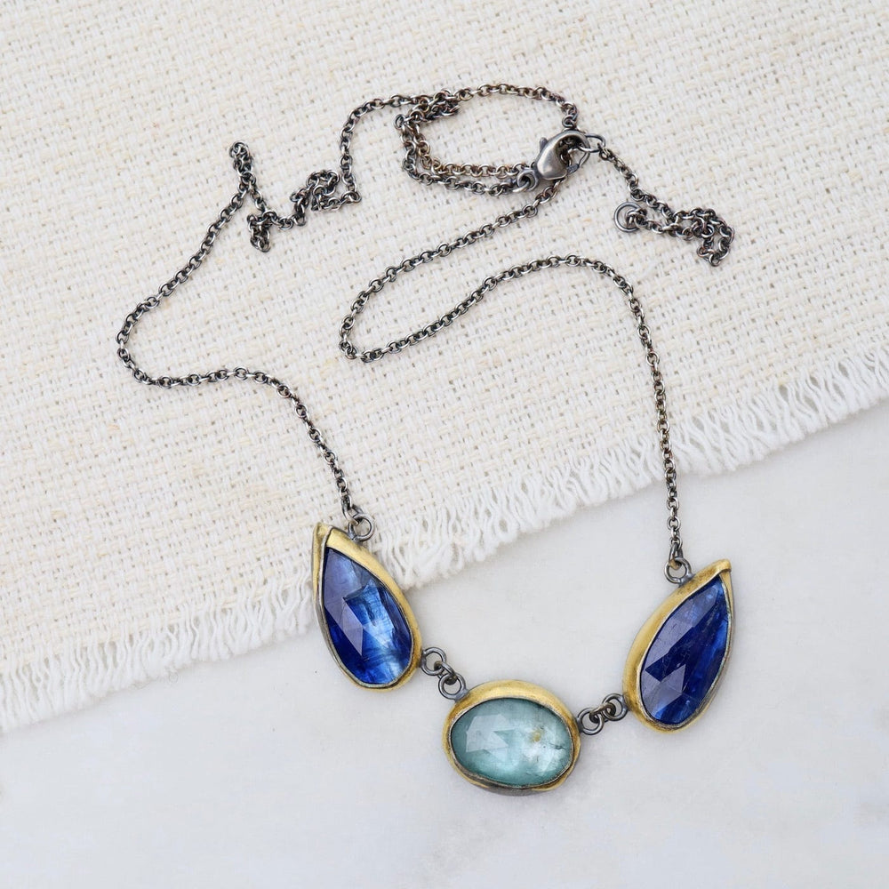 
                      
                        NKL Bright Blue Kyanite 3 Stone Teardrop & Oval Crescent Rim Necklace
                      
                    