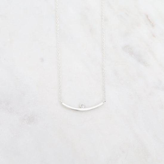 NKL Brushed Sterling Curved Bar Necklace with White Sapphire