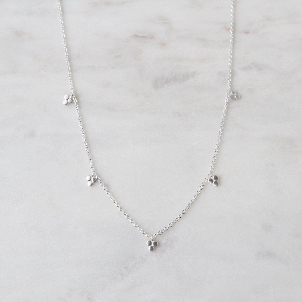 
                  
                    NKL Brushed Sterling Silver Tri-Dot Dangle Necklace
                  
                