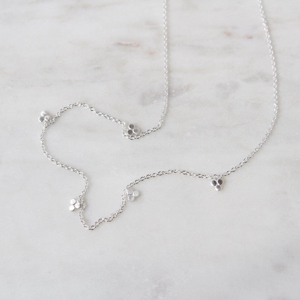 
                  
                    NKL Brushed Sterling Silver Tri-Dot Dangle Necklace
                  
                