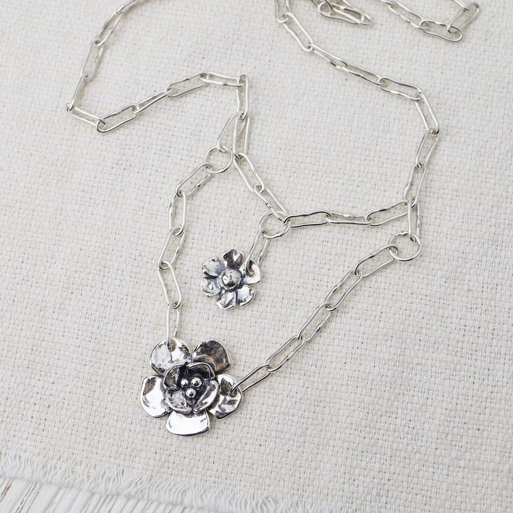 
                  
                    NKL Chain Layer Necklace With Daisy & Double Dogwood on Short Oval Chain
                  
                