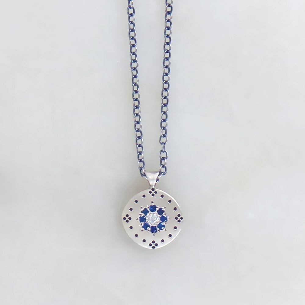 
                      
                        NKL Cluster Pendant with Sapphire Floret
                      
                    