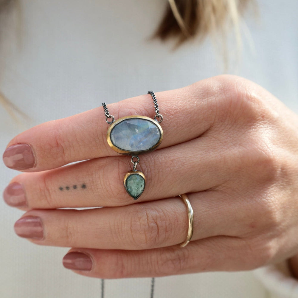 
                      
                        NKL Crescent Rim Drop Necklace with Moonstone & Sky Blue Kyanite
                      
                    