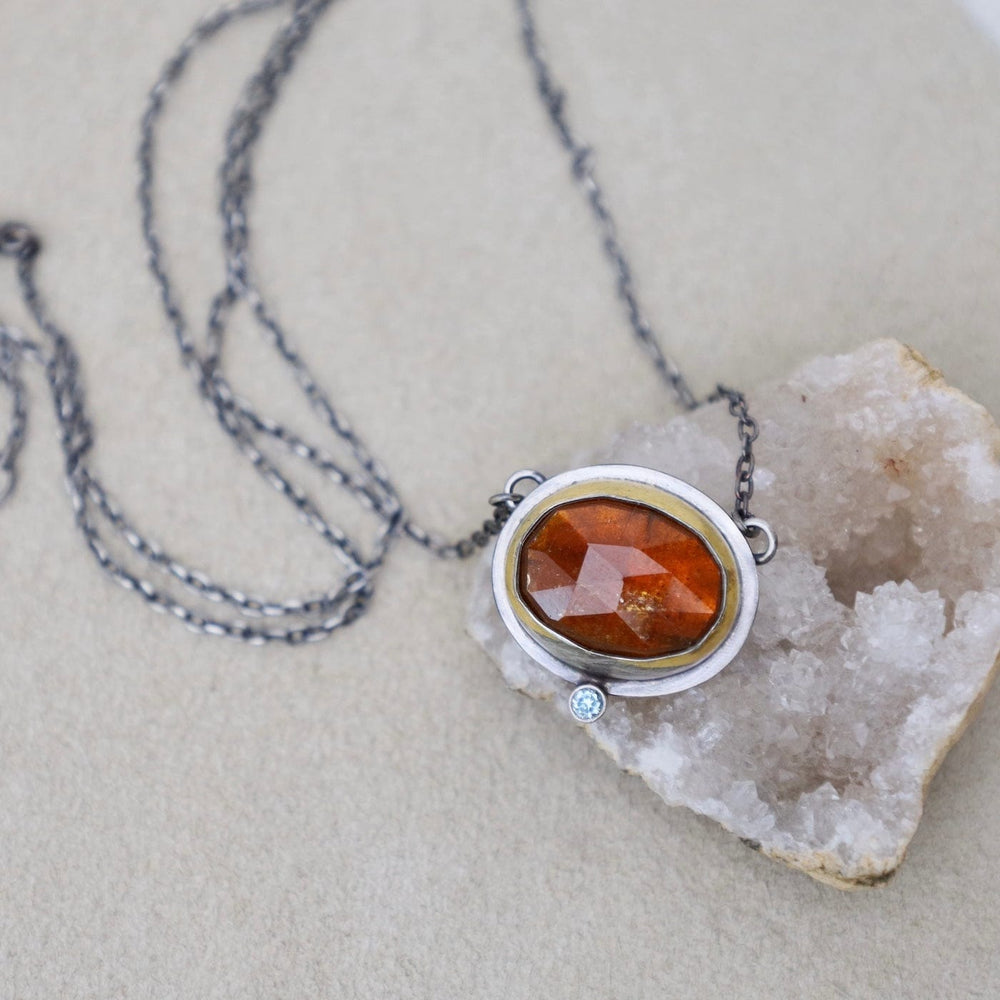 
                  
                    NKL Crescent Rim Necklace with Orange Kyanite
                  
                