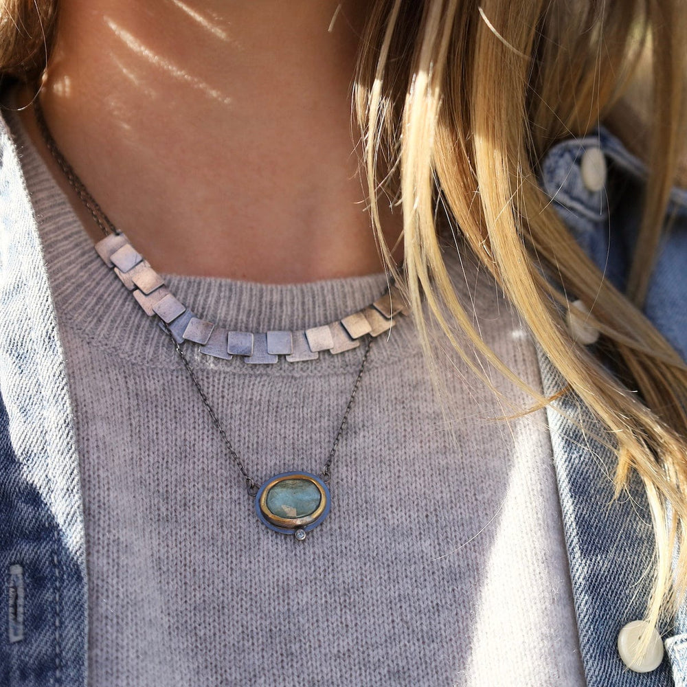 
                      
                        NKL Crescent Rim Necklace with Sky Blue Kyanite
                      
                    