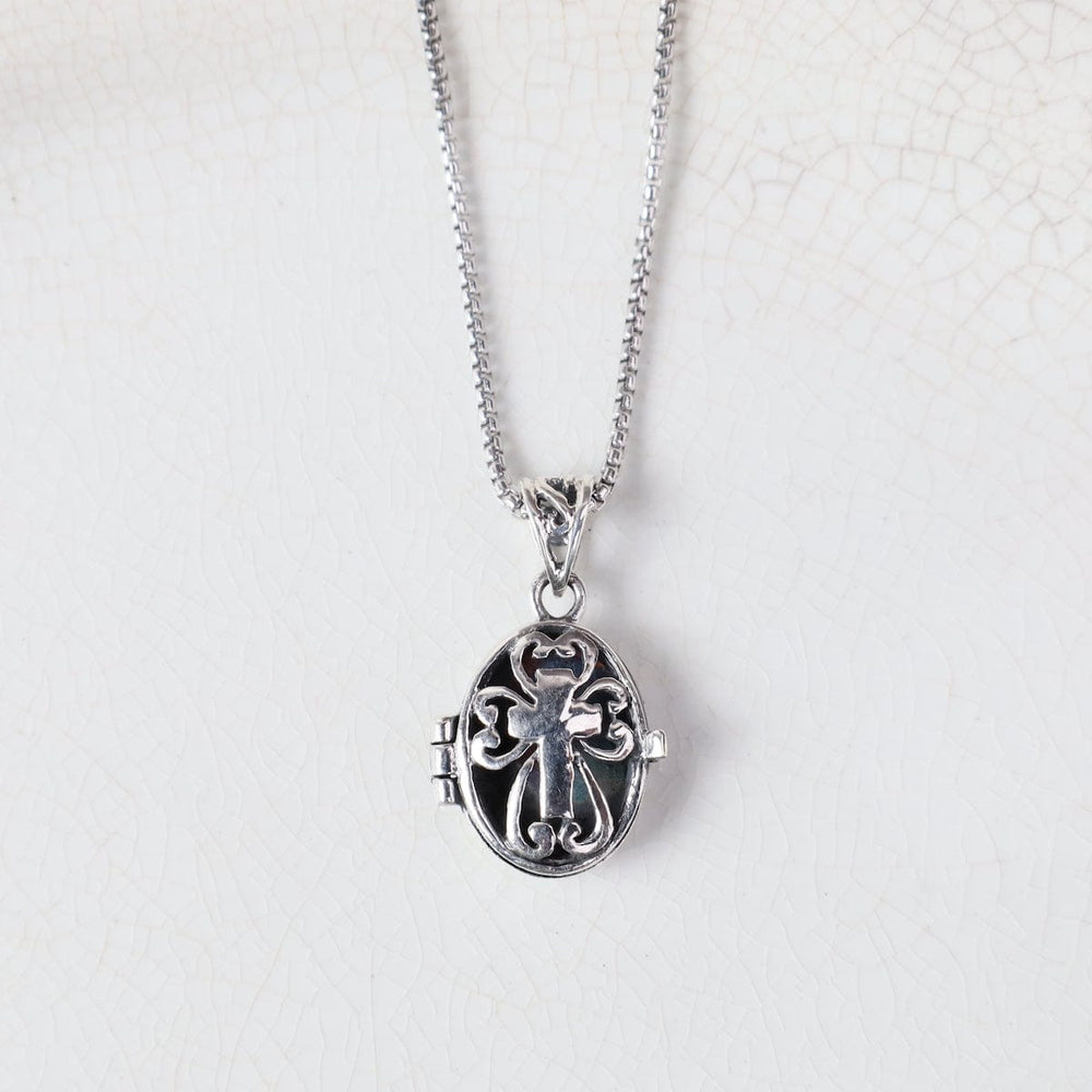 
                  
                    NKL Cross in Filagree Oval Locket Necklace
                  
                