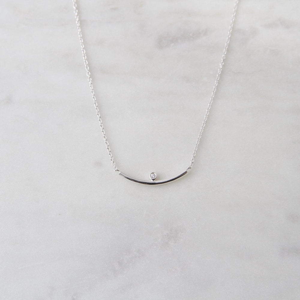 NKL Curved bar necklace with bezel set CZ