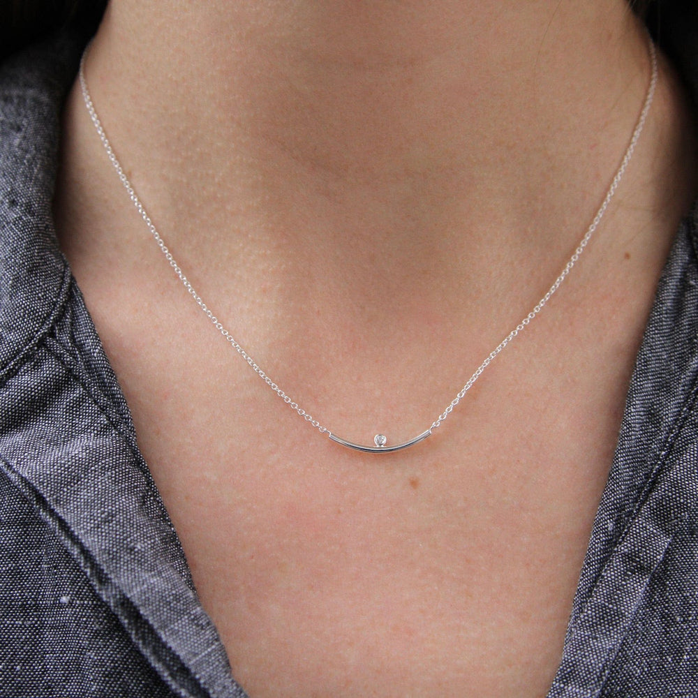 NKL Curved bar necklace with bezel set CZ