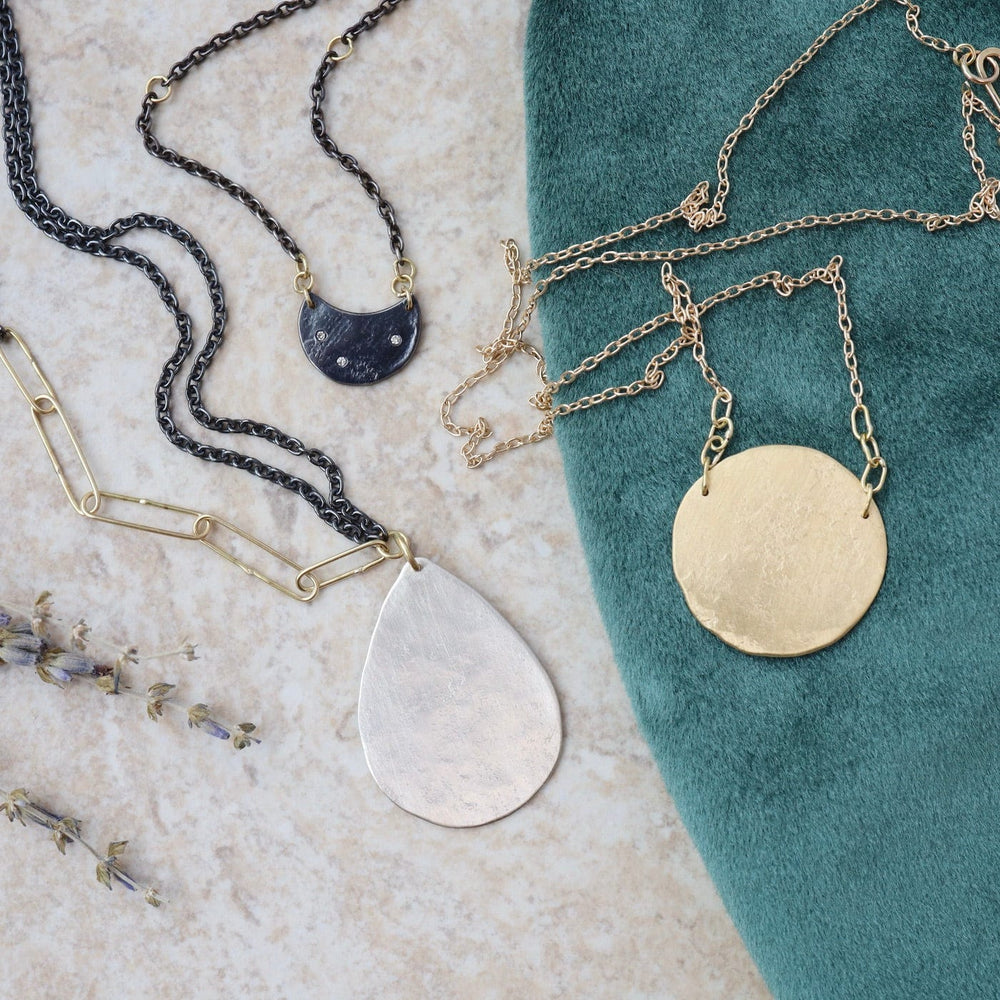 
                  
                    NKL Dark Moon Necklace
                  
                