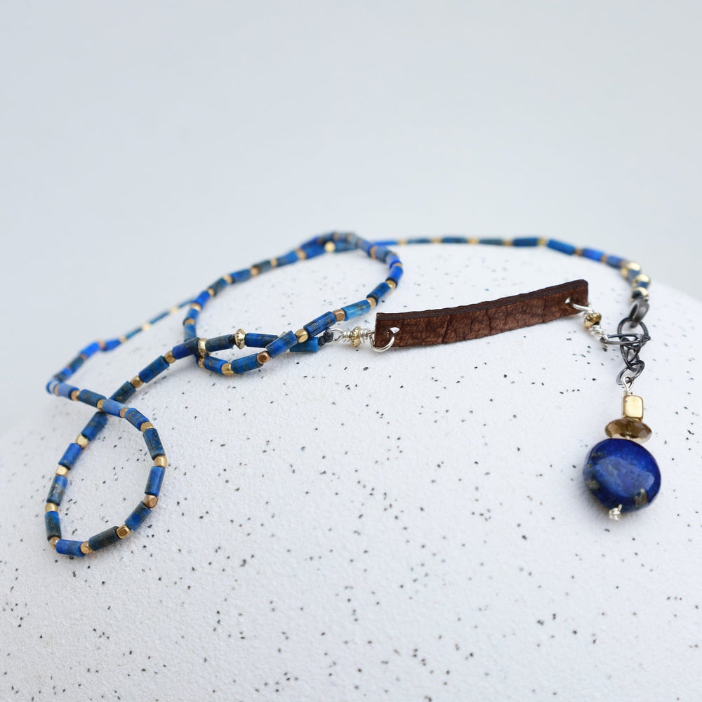 
                  
                    NKL Delicate Lapis & Leather Necklace
                  
                