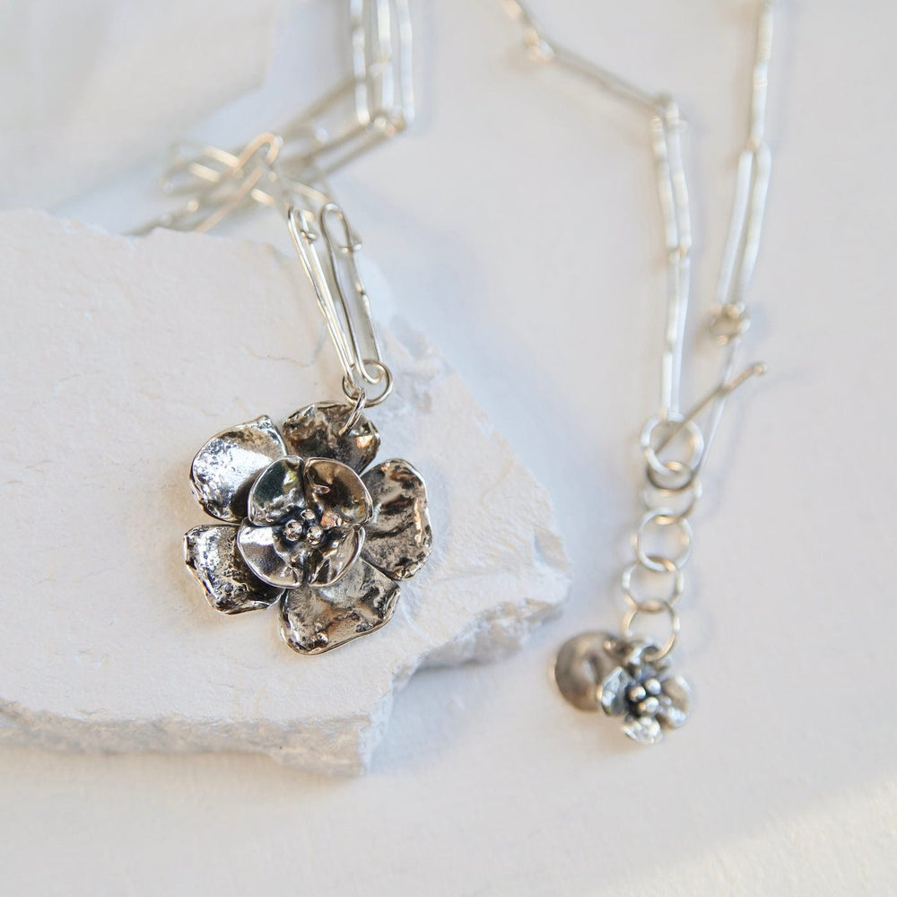 
                      
                        NKL Double Double Dogwood Charm on Handmade Oval Link
                      
                    