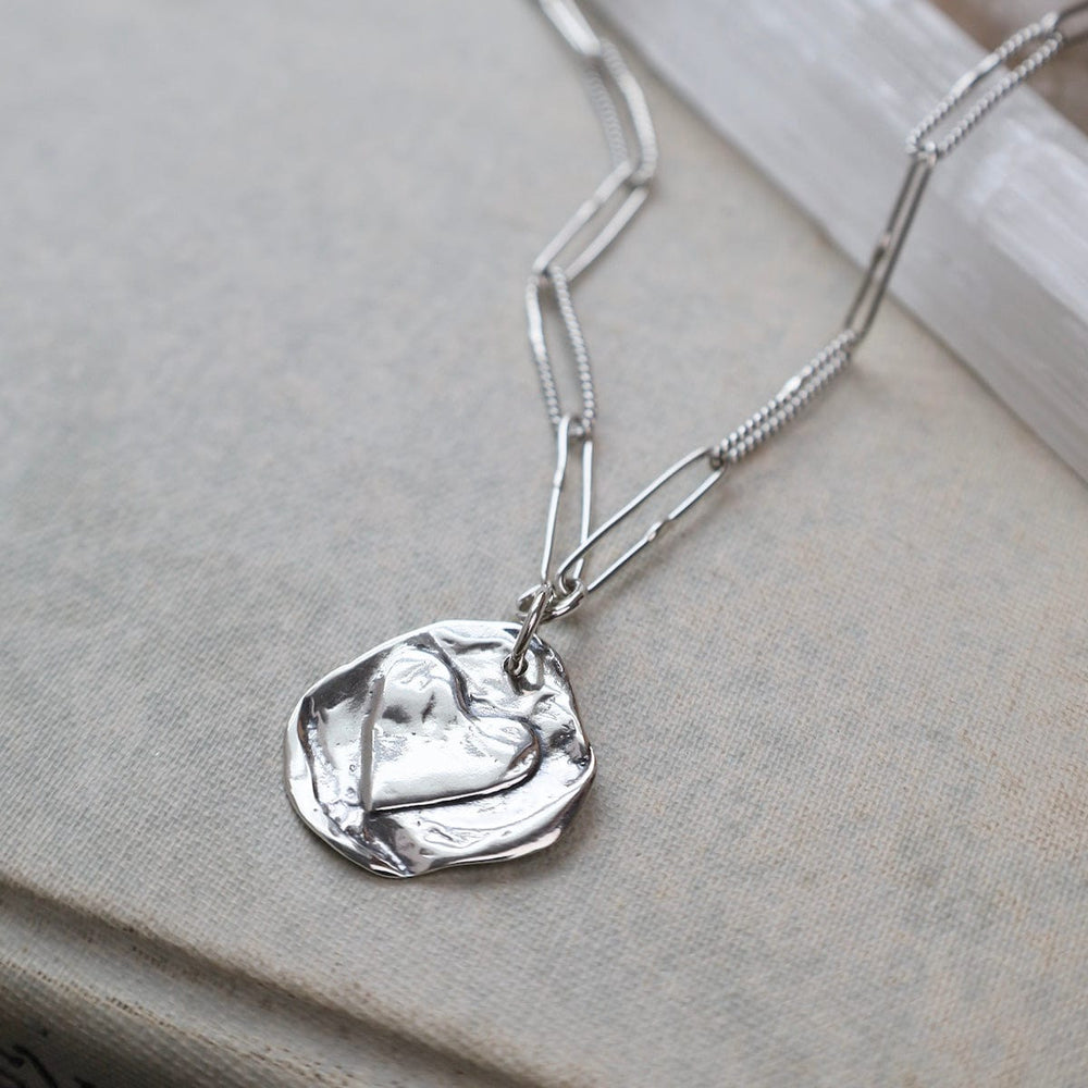 
                      
                        NKL Double Sided Heart and Star Charm on Handmade Oval
                      
                    