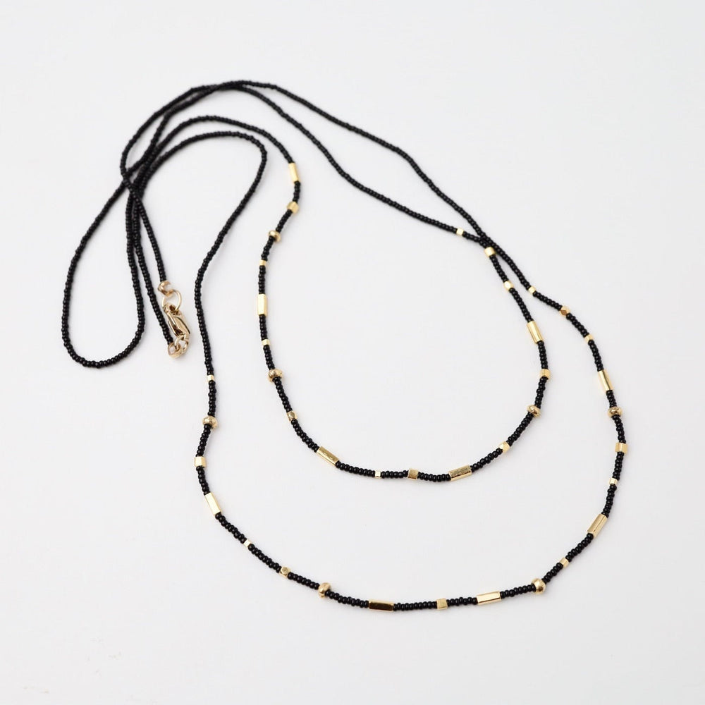 
                      
                        NKL Double Strand Tiny Black Seed Bead Necklace
                      
                    