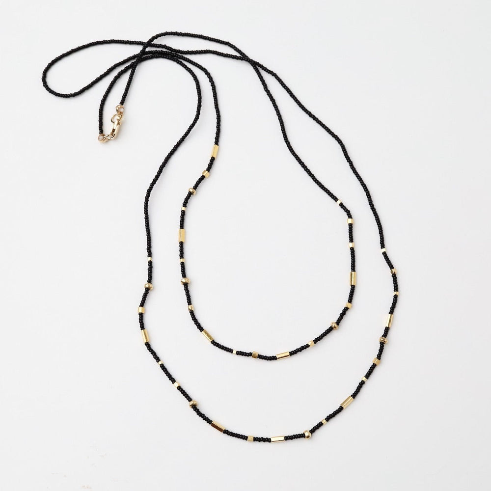 
                      
                        NKL Double Strand Tiny Black Seed Bead Necklace
                      
                    