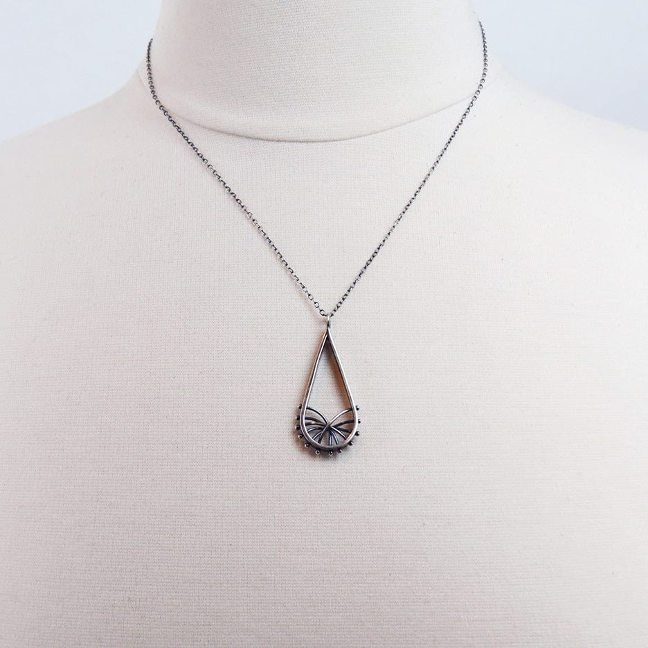 
                  
                    NKL DROPLET ARC NECKLACE
                  
                