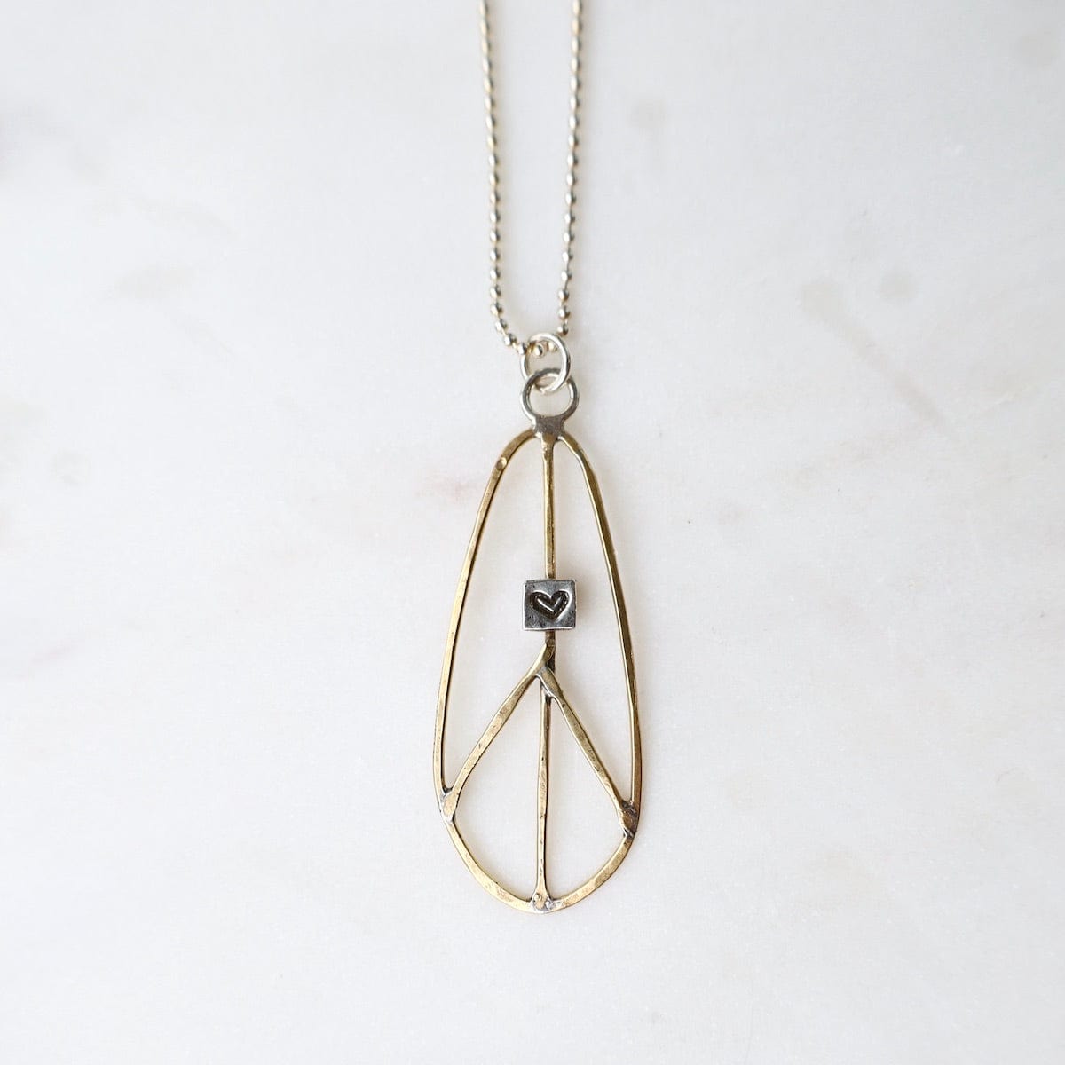 NKL Elongated Teardrop Brass Peace Sign Necklace