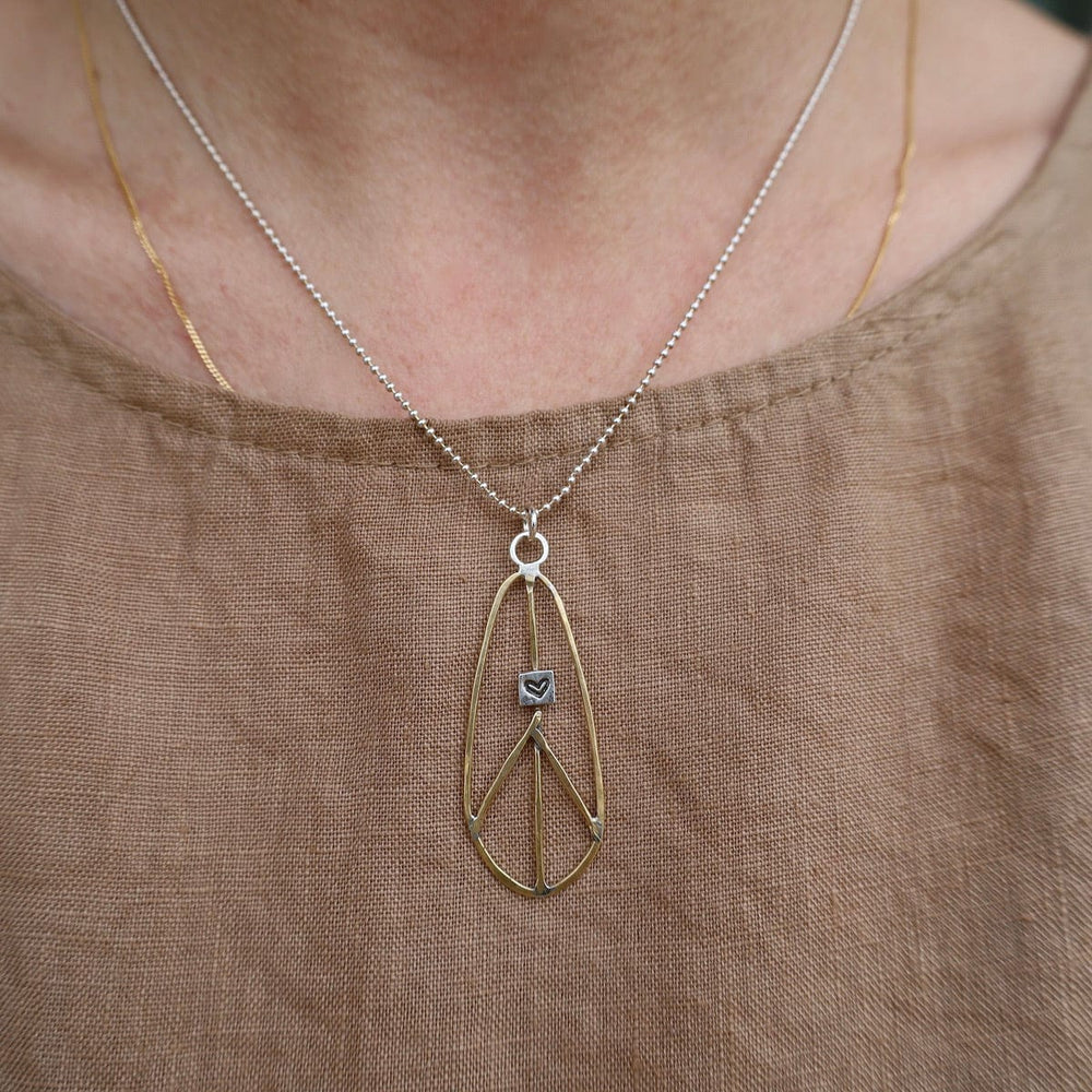 NKL Elongated Teardrop Brass Peace Sign Necklace