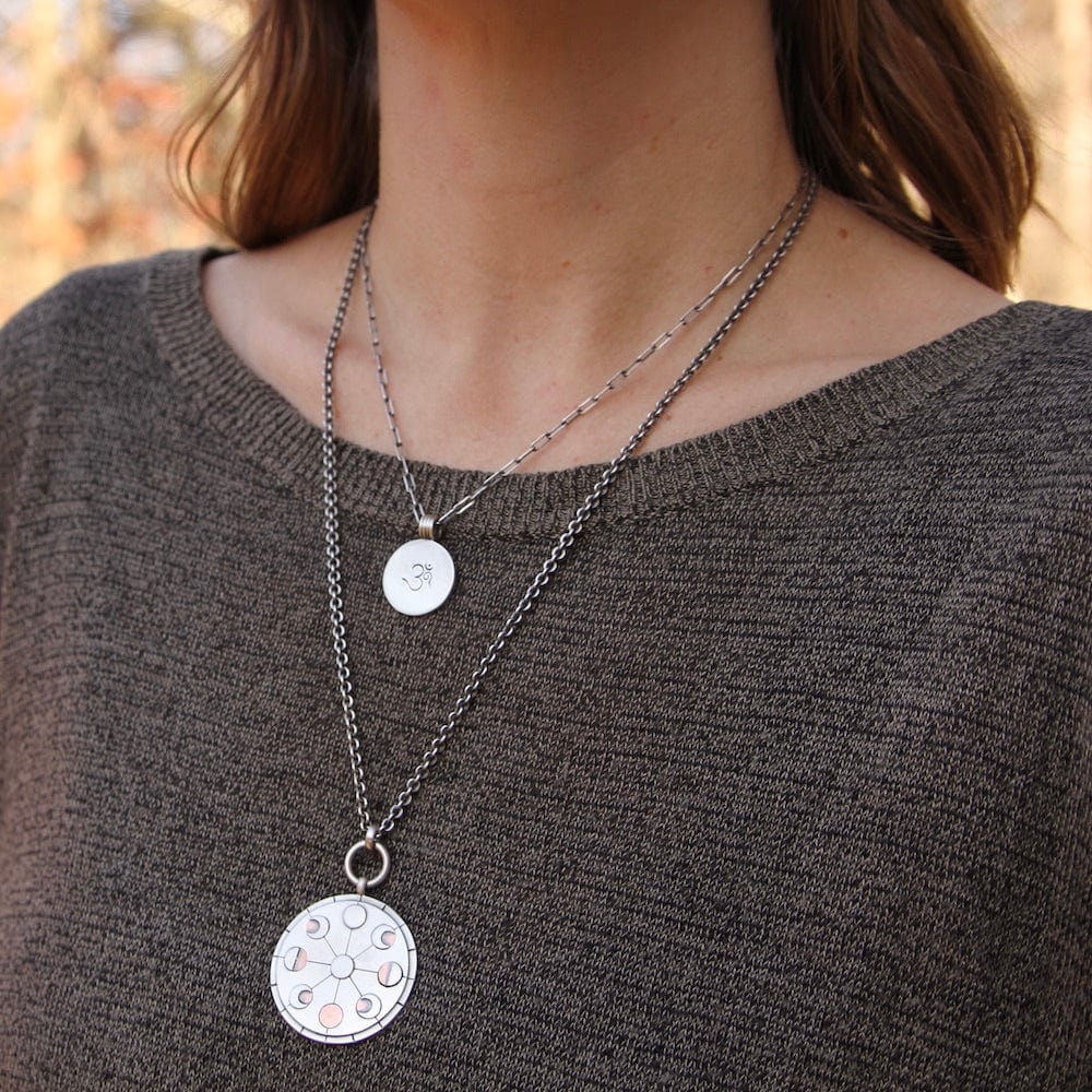 
                      
                        NKL Etched OM Disc Necklace
                      
                    