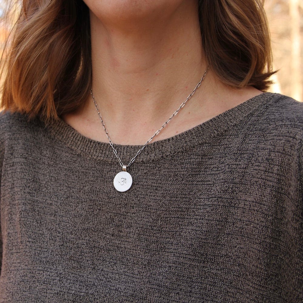 
                      
                        NKL Etched OM Disc Necklace
                      
                    