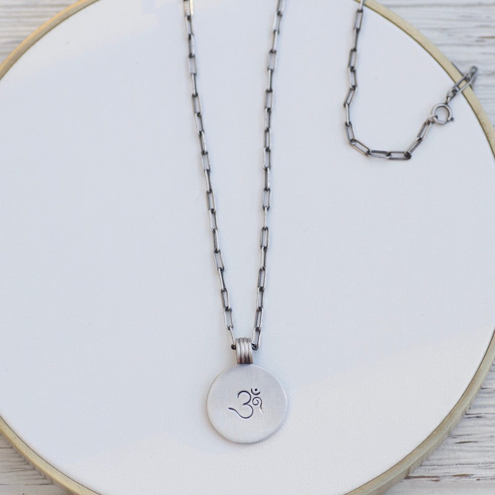 
                      
                        NKL Etched OM Disc Necklace
                      
                    