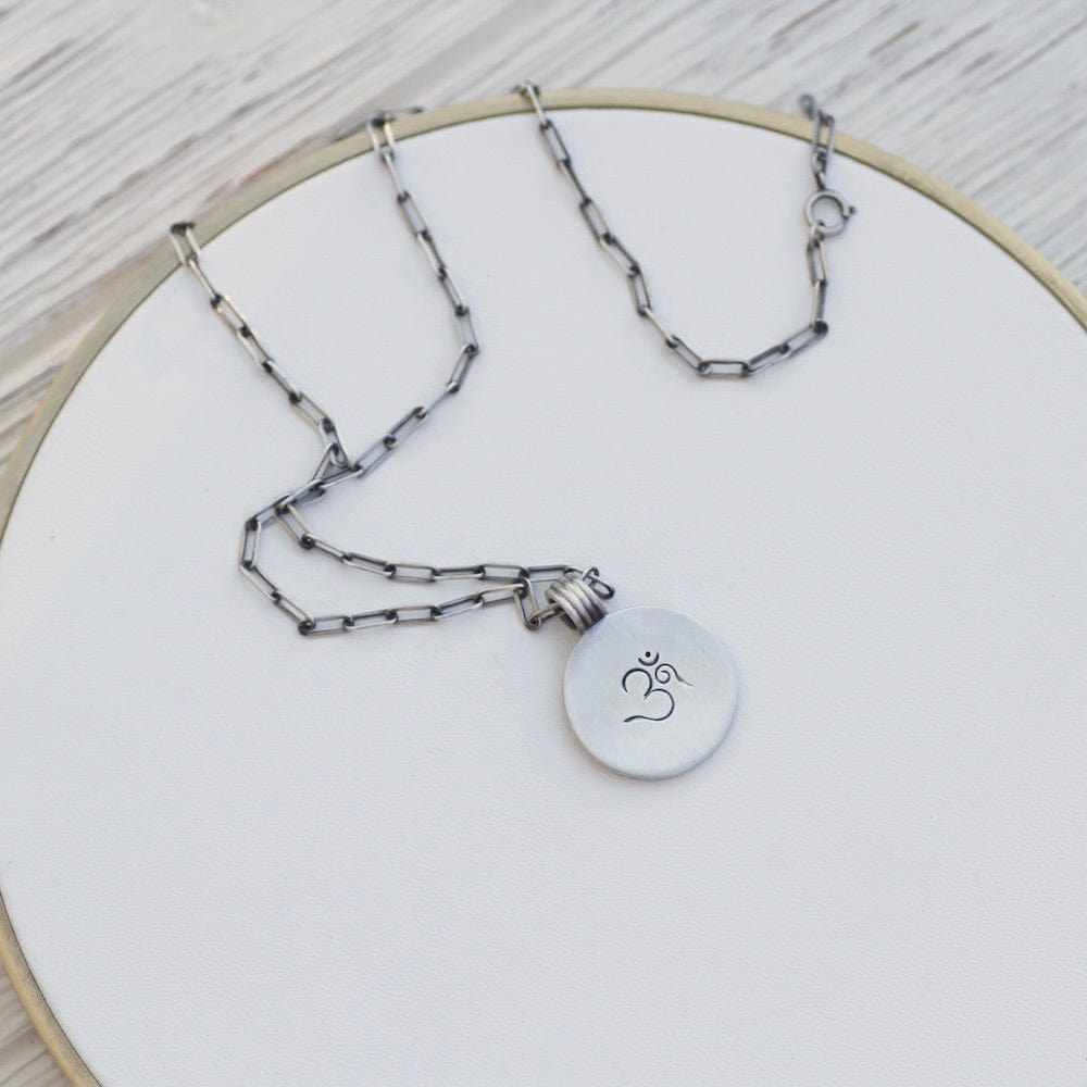 
                      
                        NKL Etched OM Disc Necklace
                      
                    